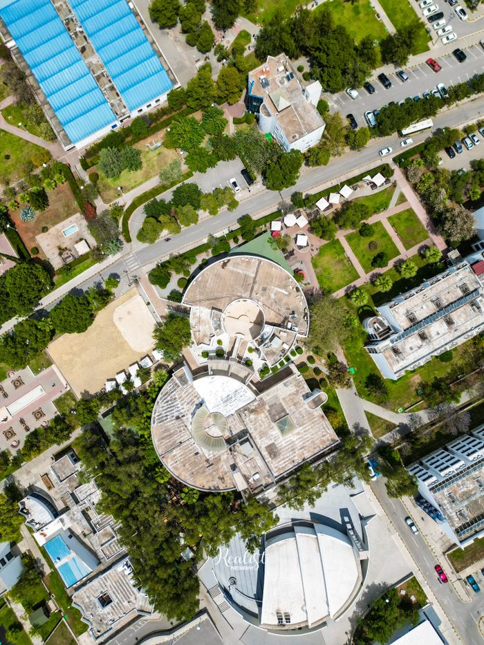 Home Aerial view of circular buildings and town layout in Lefke, showcasing urban planning.